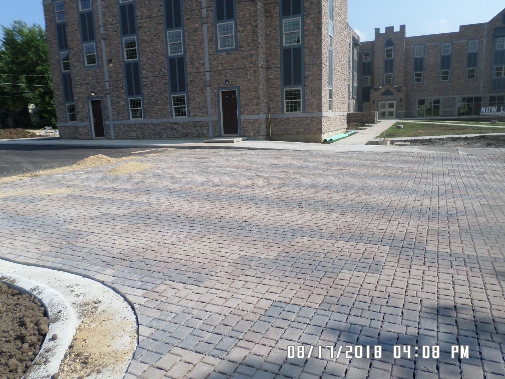 Commercial-scale paver parking lot installation at a large brick building, southwest Wisconsin