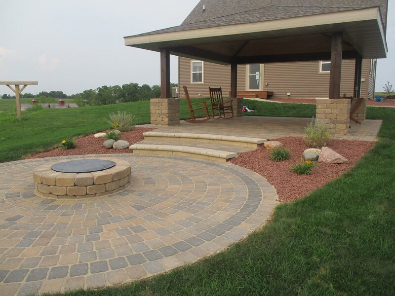 Paver steps and patio with built-in fire pit and grill area